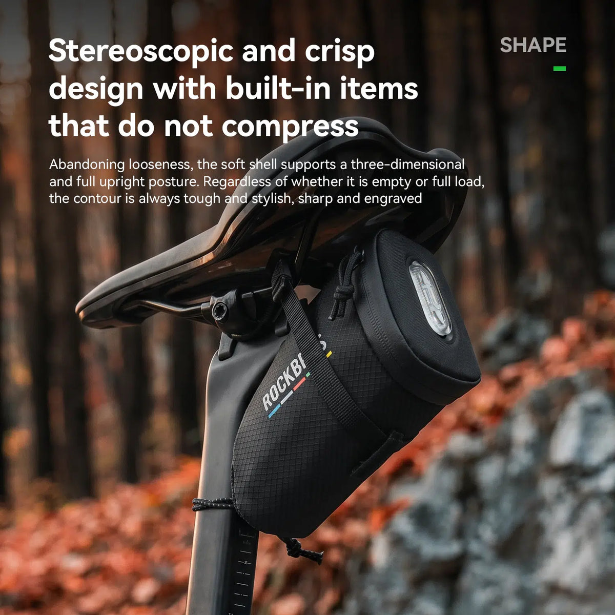 A black bicycle saddle bag mounted on a bicycle saddle in an outdoor forest setting. The image includes promotional text highlighting the product's ergonomic design and comfort.