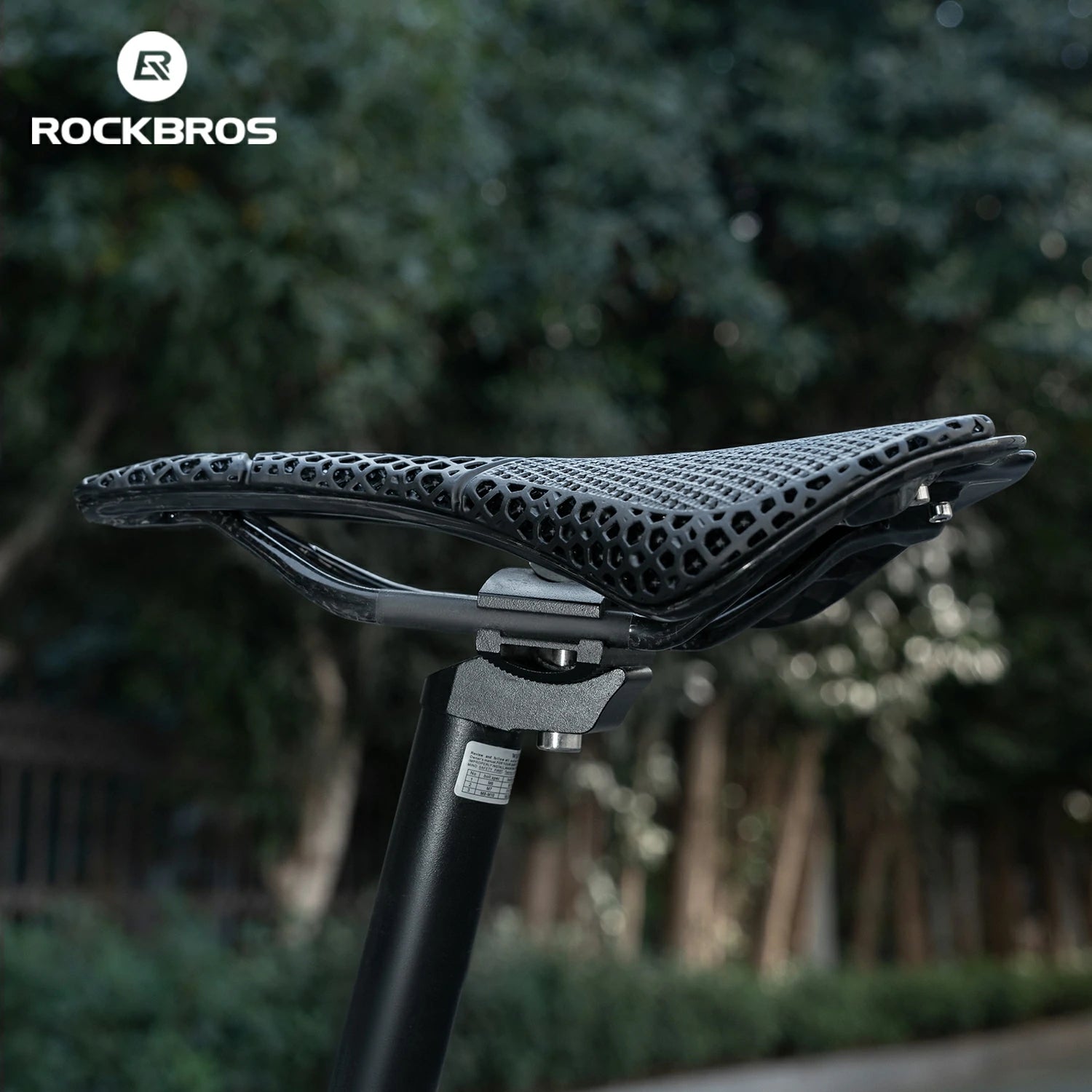 Bicycle seat with a blurred natural background and RockBros branding.