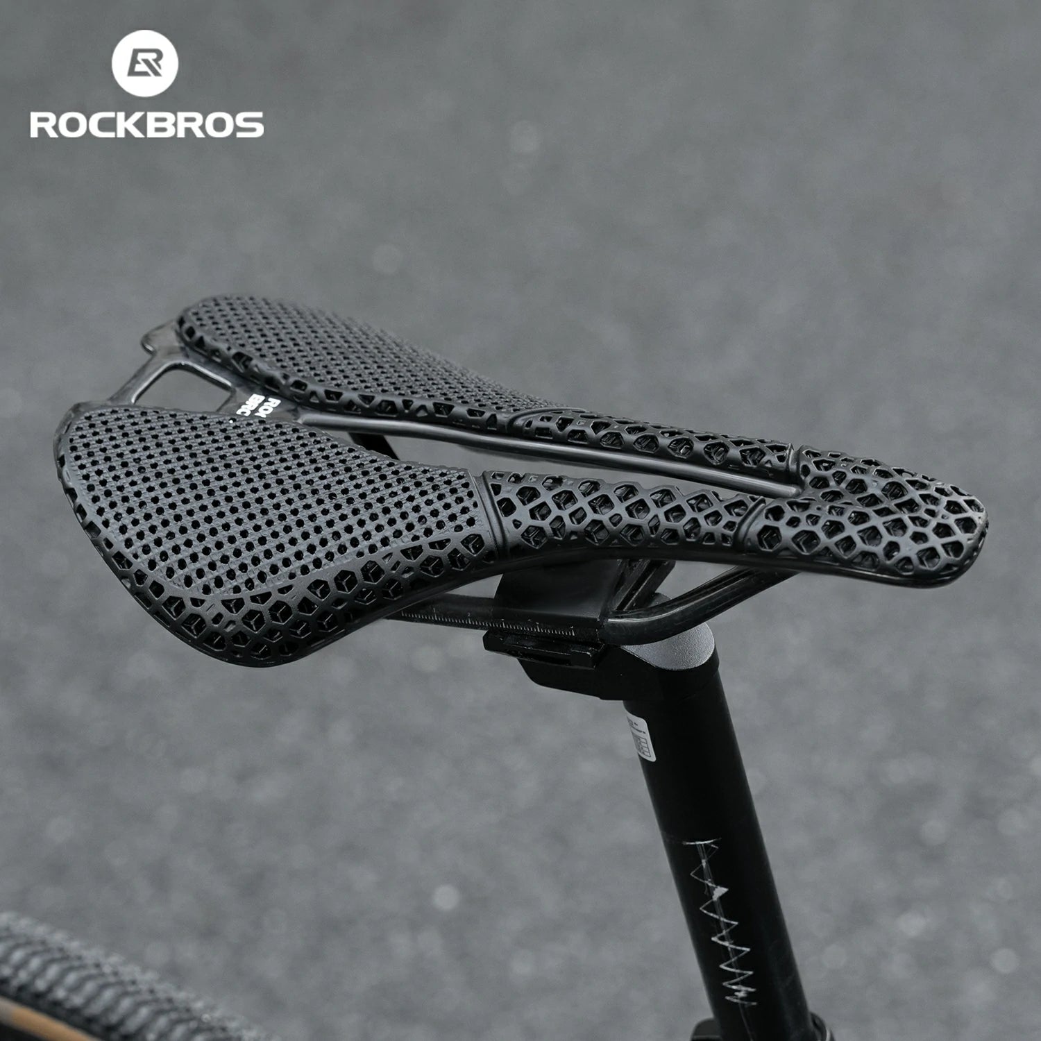 Bicycle saddle with textured design on a gray background, featuring the RockBros brand.