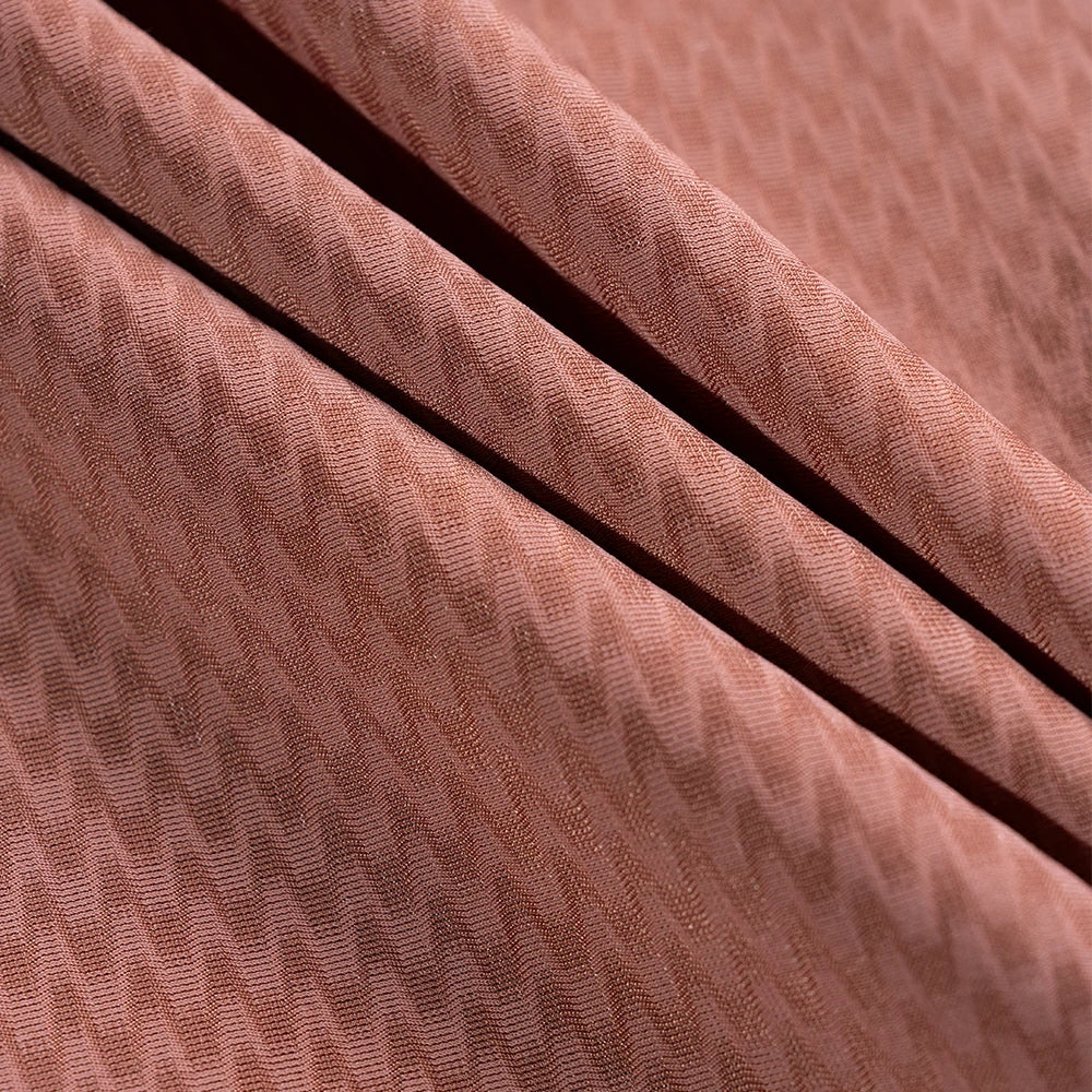 Close-up of textured brown fabric with a subtle pattern #Color_Red