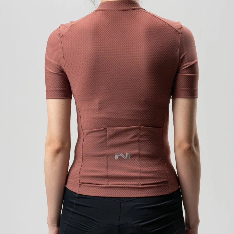 Brown athletic shirt with a brand logo on a gray background #Color_Red