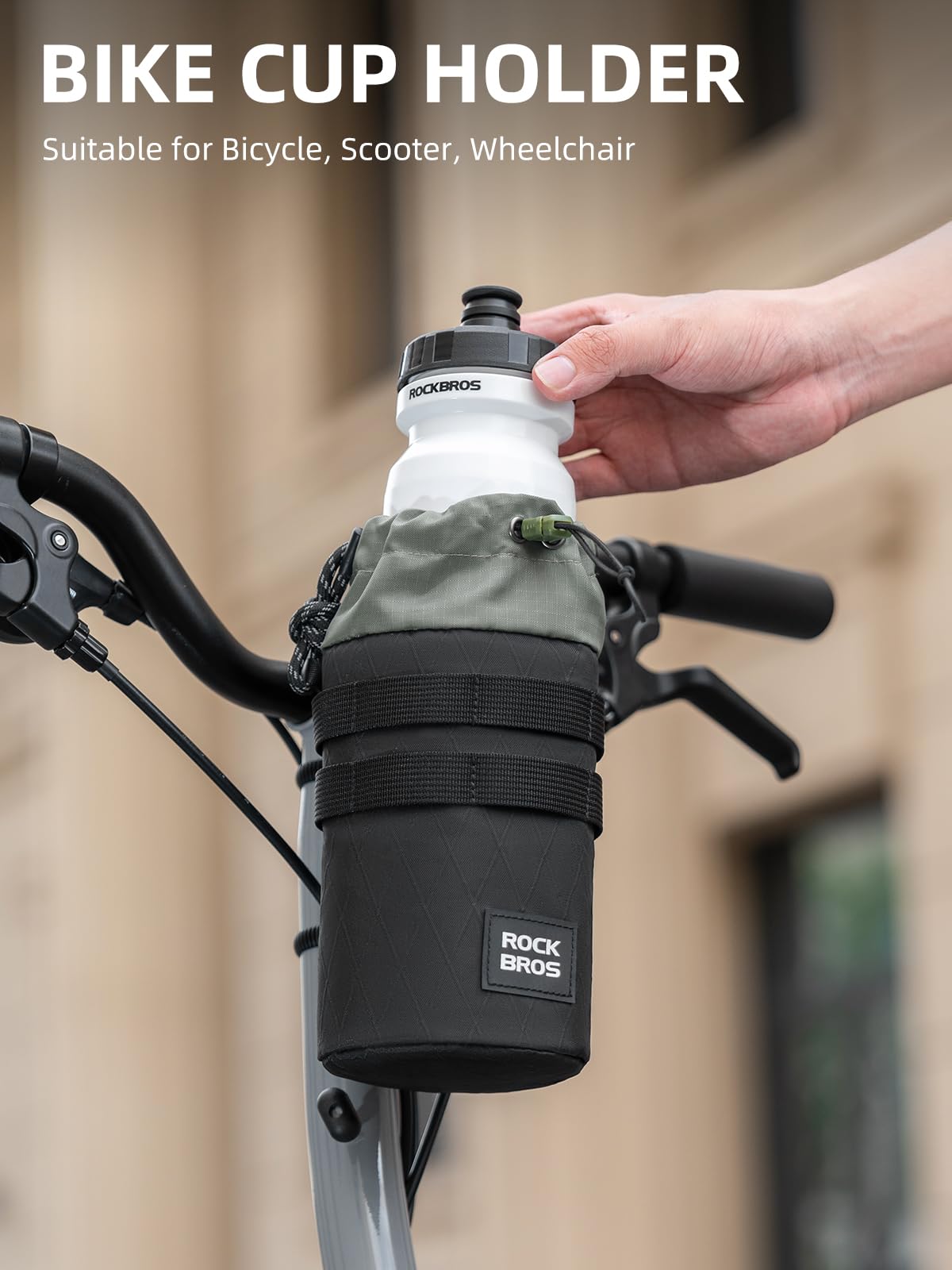Bike cup holder attached to a bicycle handlebar with a hand holding a water bottle.