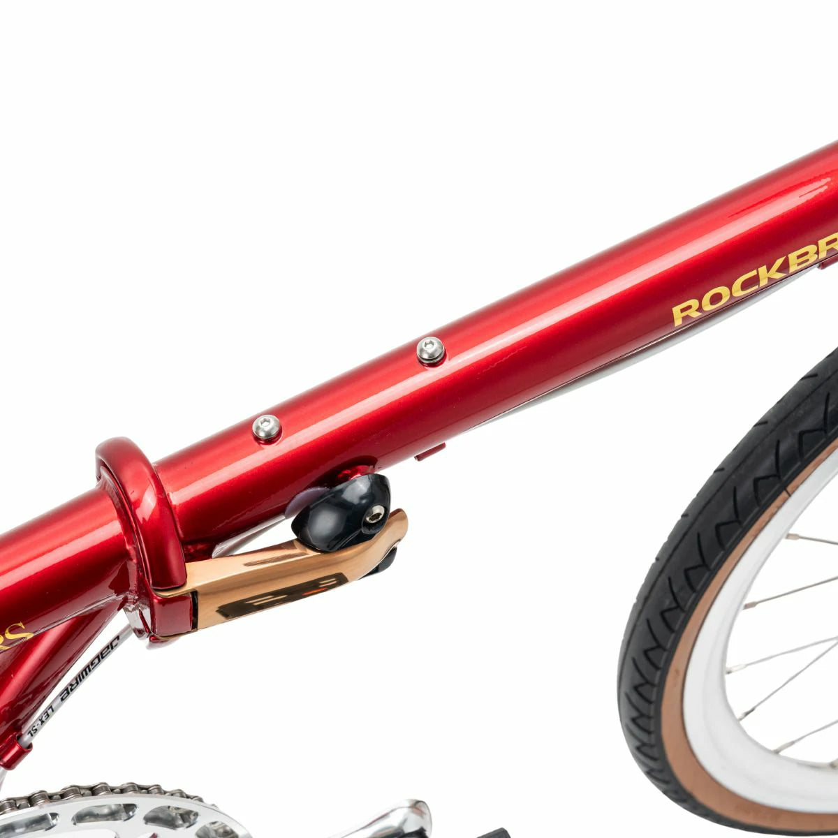 Close-up of a red bicycle frame with 'Rockbr' branding on a white background #Color_Red
