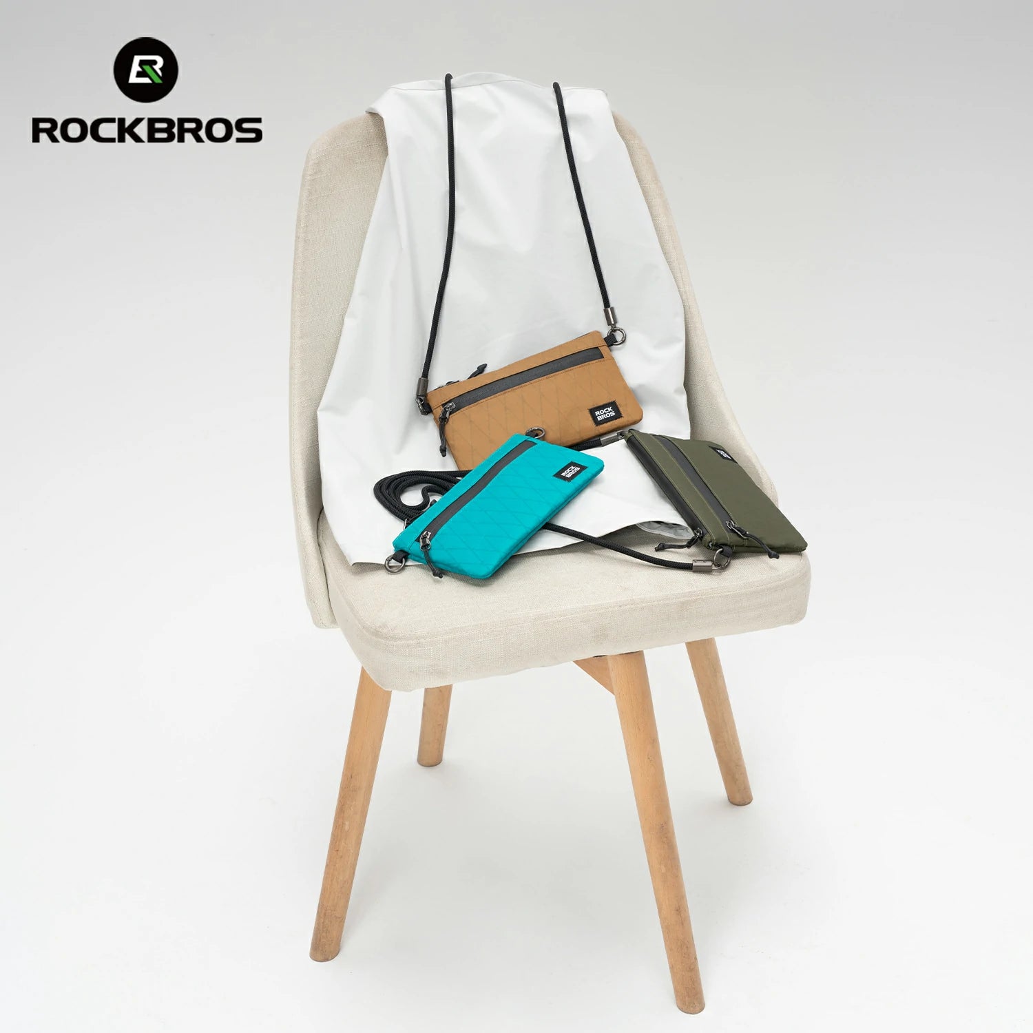 Three small bags on a chair with 'Rockbros' branding.