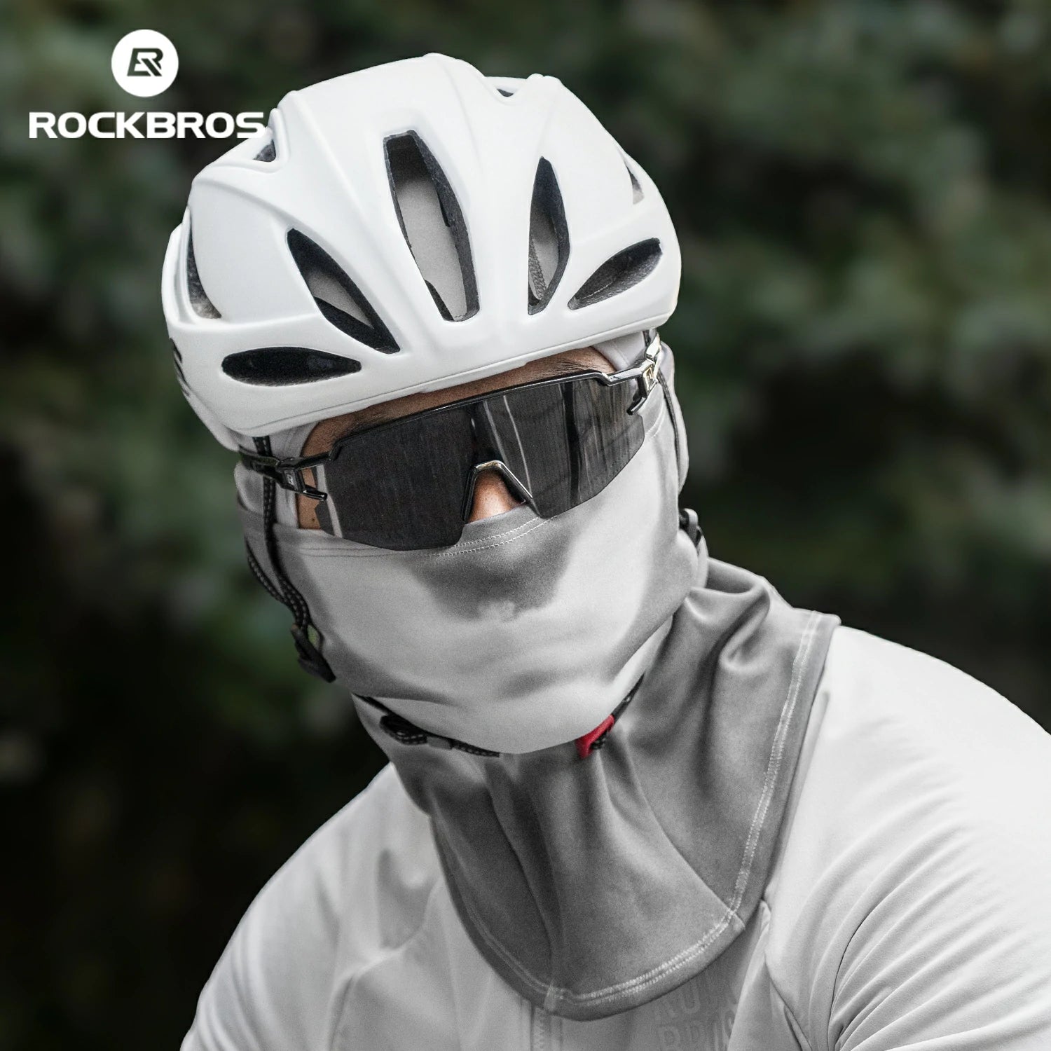 Person wearing a white helmet and gray balaclava with ROCKBROS logo in the corner.#color_Dark Gray
