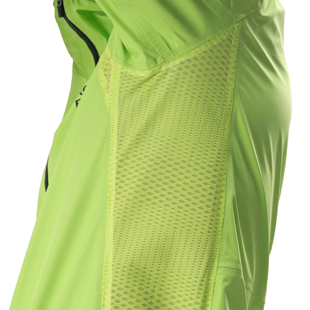 Close-up of a bright lime green athletic jacket showing the sleeve construction, including a textured mesh panel and a black zipper.