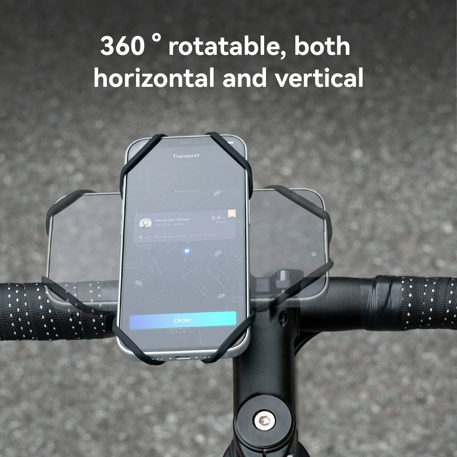 A black bicycle handlebar phone mount holding a smartphone, shown outdoors on a road with white text reading '360° rotatable, both horizontal and vertical'.