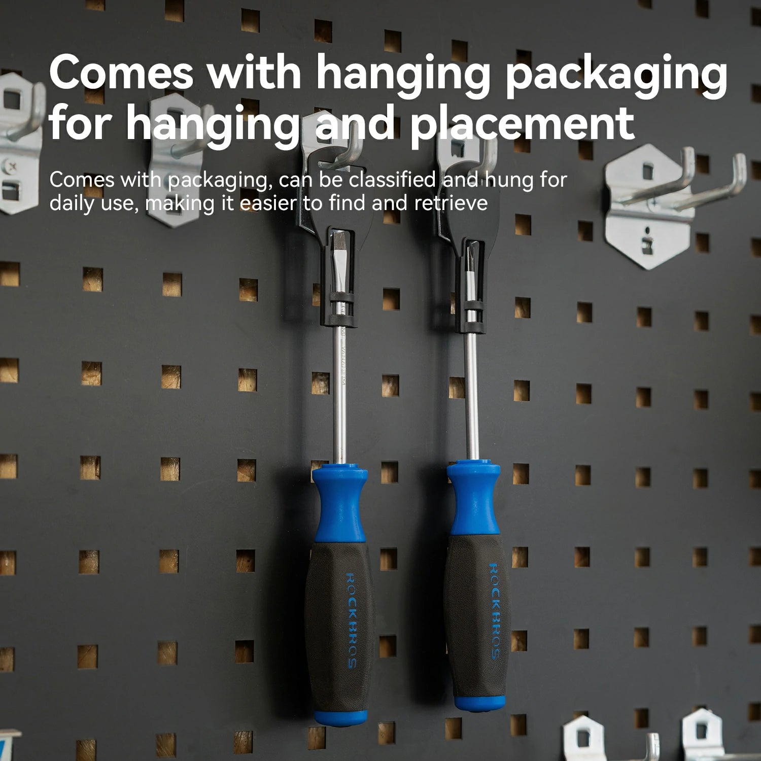 Two screwdrivers with blue and black handles hang on a dark gray pegboard, with white text at the top explaining hanging packaging.