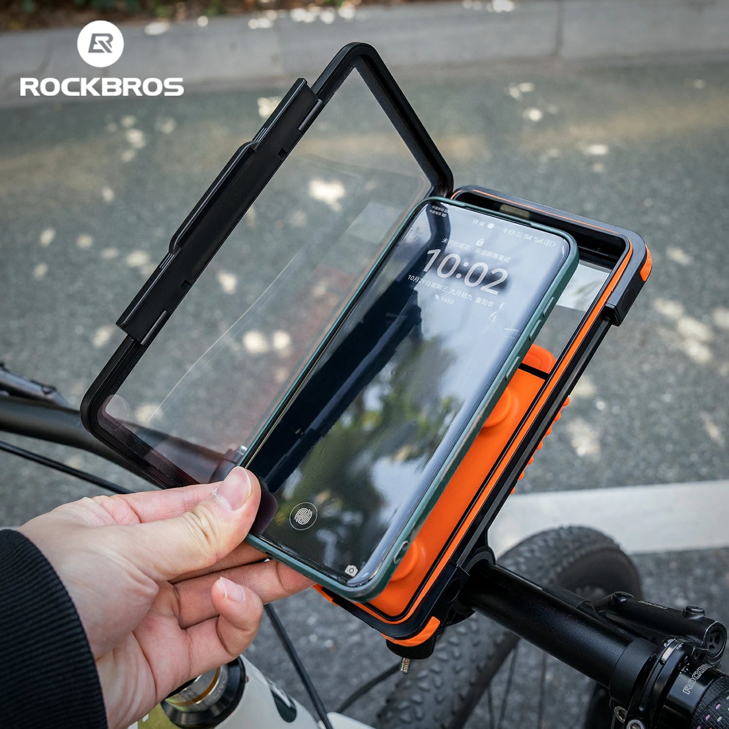 Phone mount on a bicycle handlebar with RockBros branding