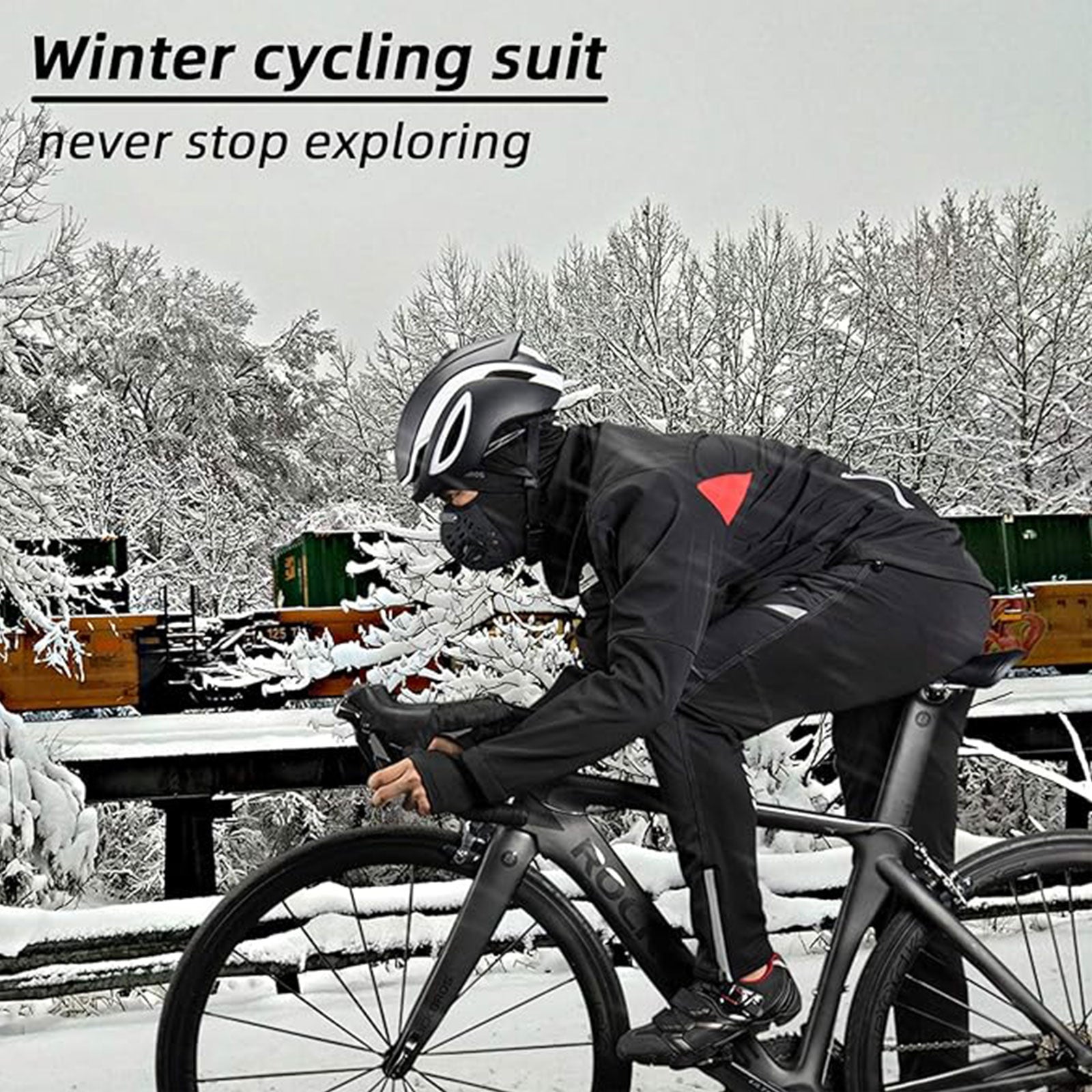 Person in winter cycling suit on a bike with snowy landscape