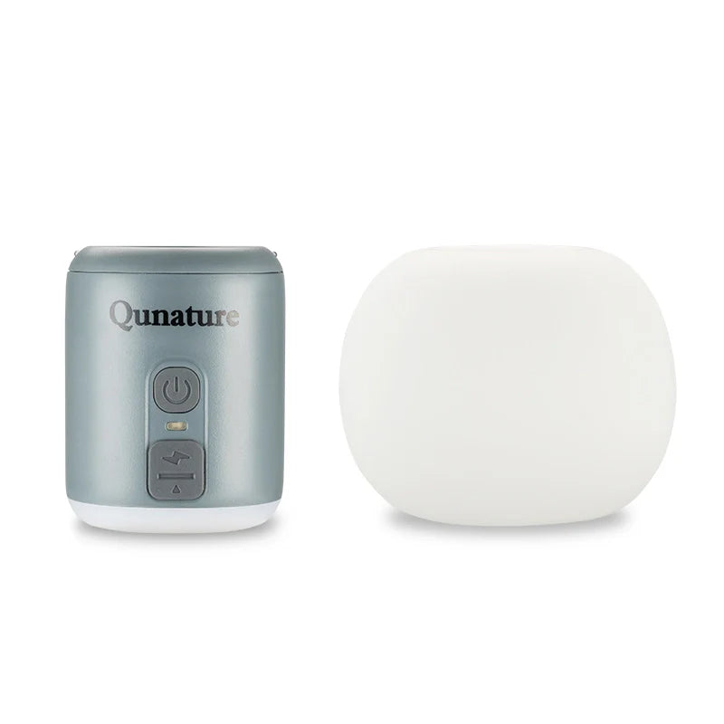 Gray device with control panel and a white spherical object on a white background, branded 'Qunature'.