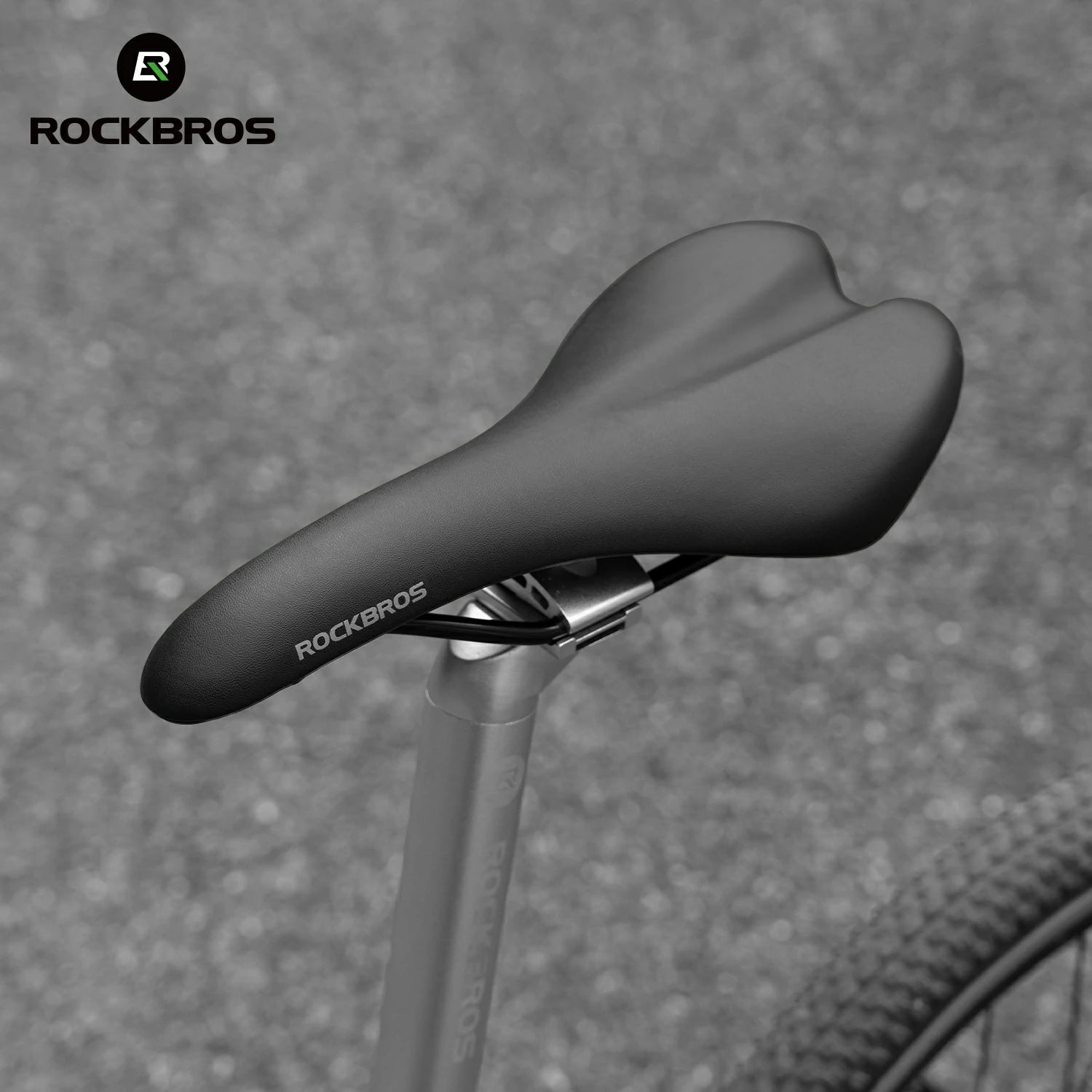 Bicycle saddle with RockBros branding on a textured gray background