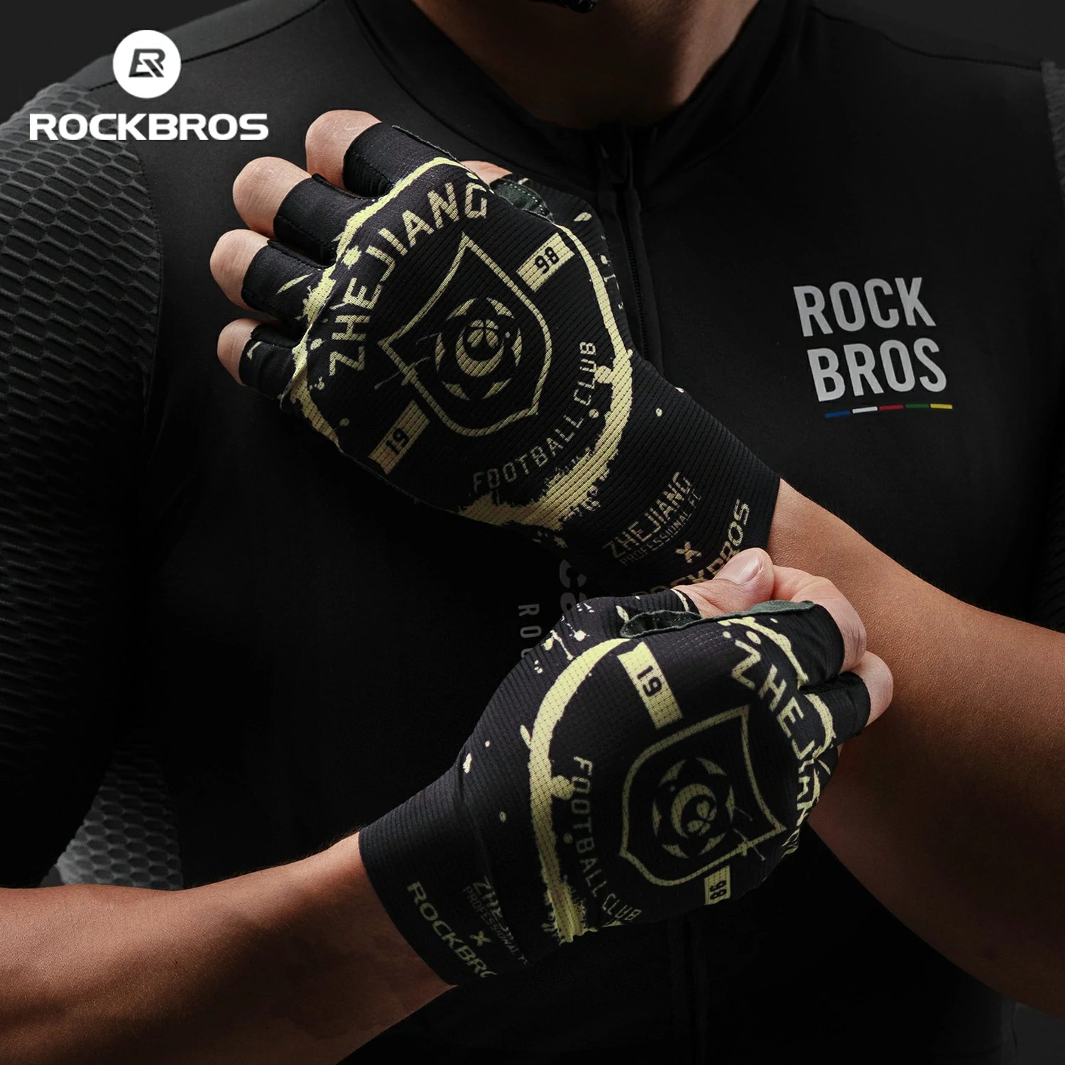 Person wearing black and yellow gloves with 'RockBros' branding, against a dark background.