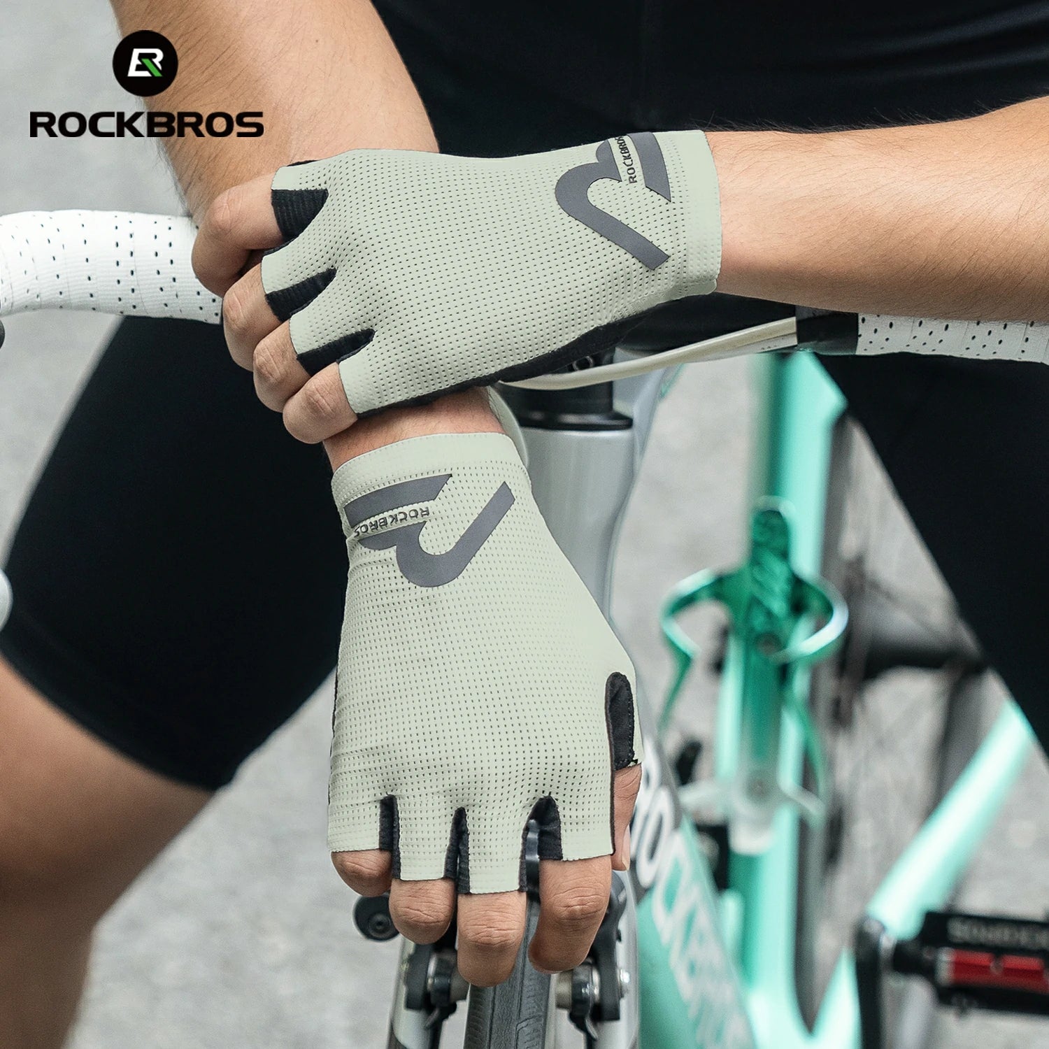Person wearing cycling gloves holding a bike handlebar with 'RockBros' branding. #color_Beige