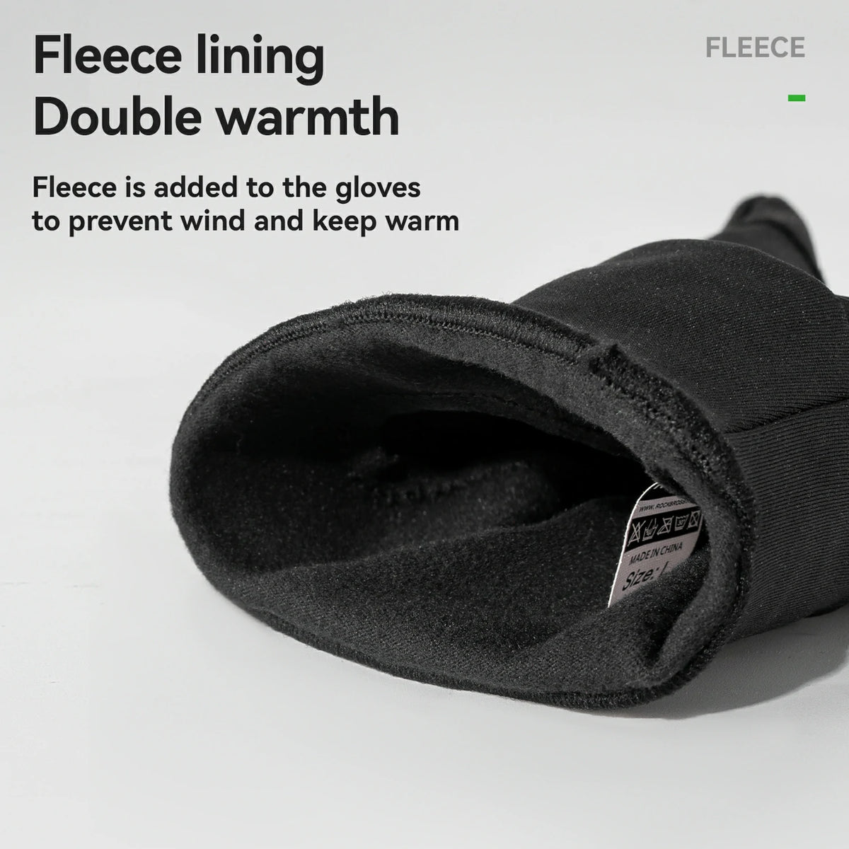 Black glove with fleece lining on a white background