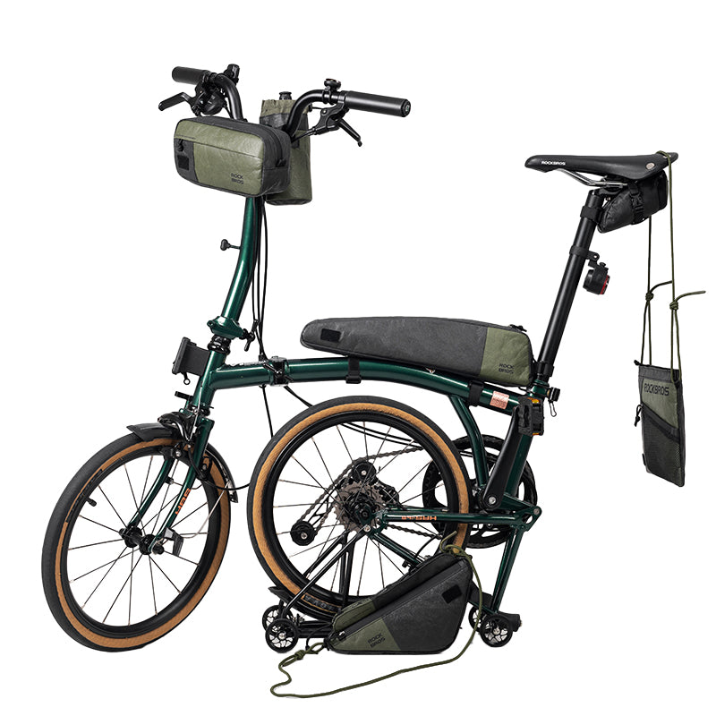 Green electric bike with folded design on a white background