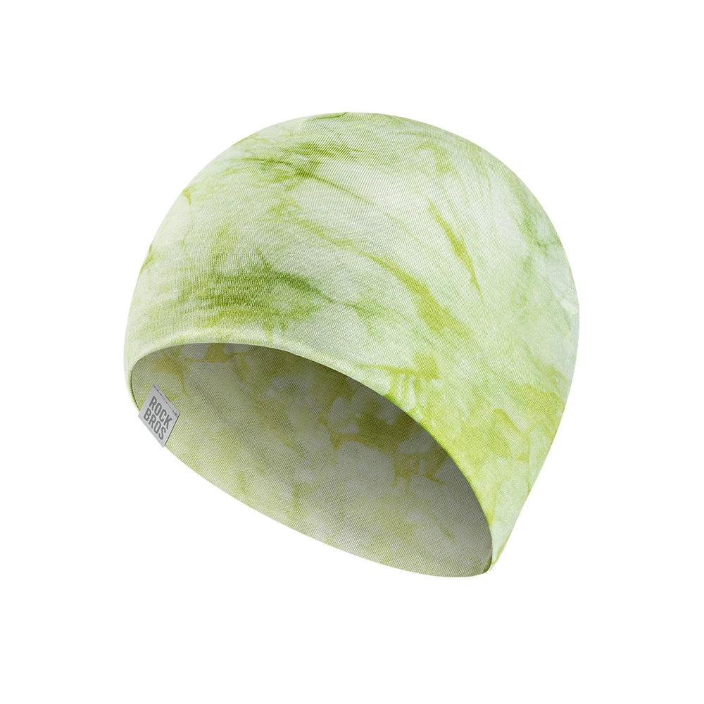 A knit beanie hat featuring a light green and white tie-dye pattern, shown on a solid white background. #Color_Green