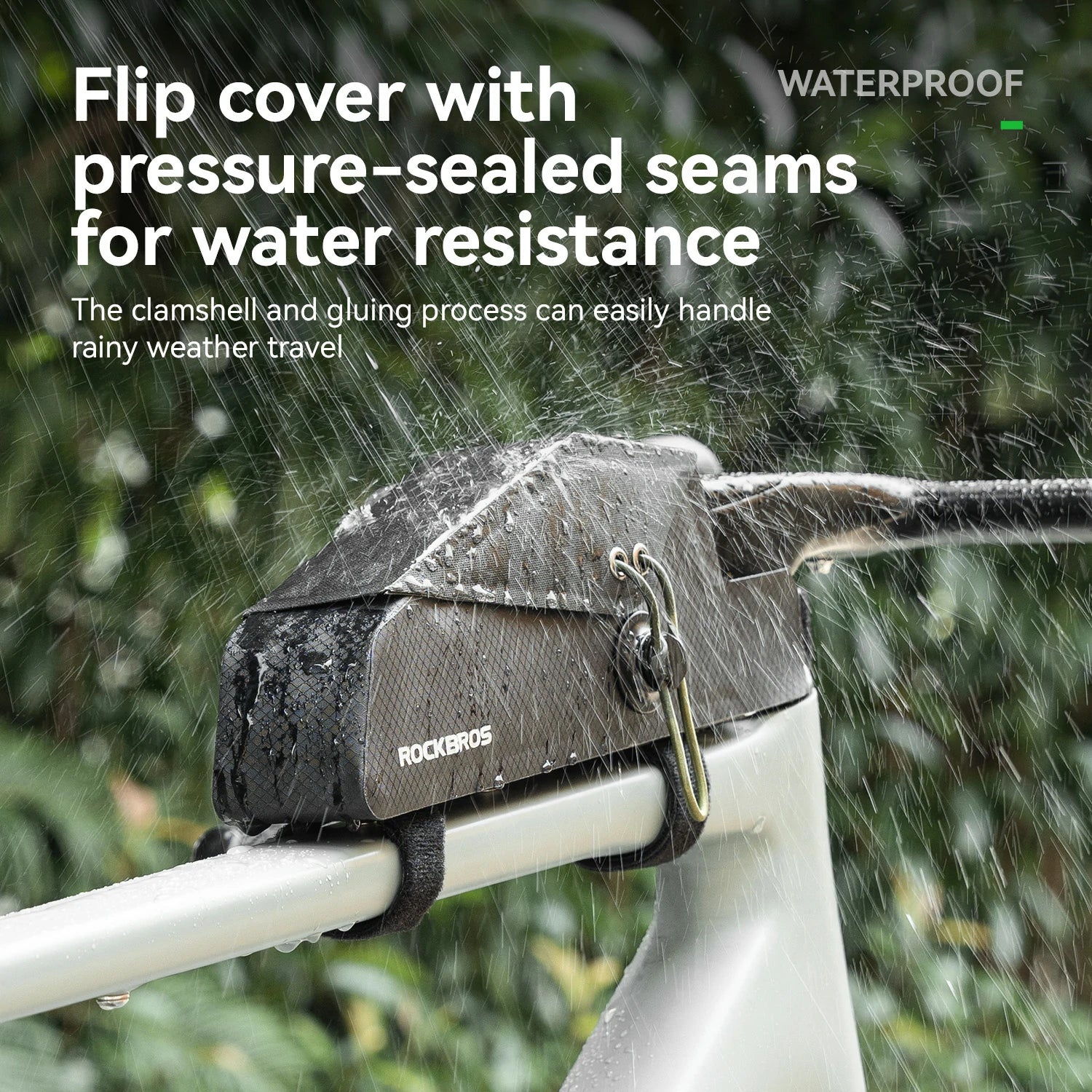 A ROCKBROS bicycle bag with a flip-top cover is shown outdoors in the rain, strapped to a white bicycle frame. The image features text overlays highlighting its waterproof and pressure-sealed features.