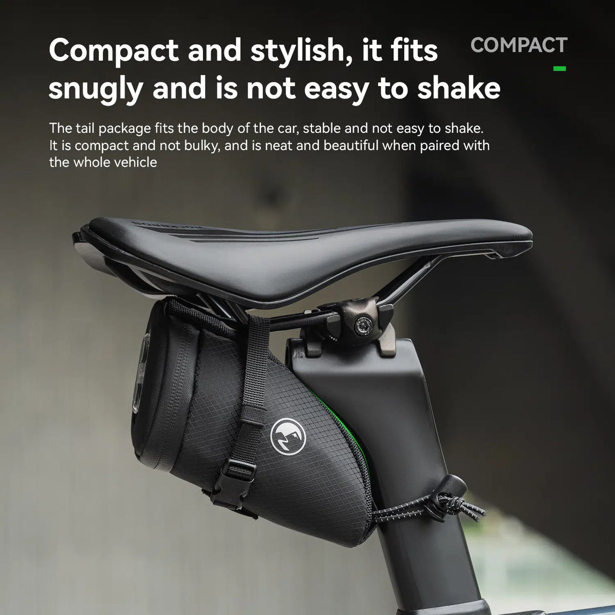 A black bicycle saddle bag mounted on the seat post beneath the saddle, shown with marketing text describing its compact, stable design.
