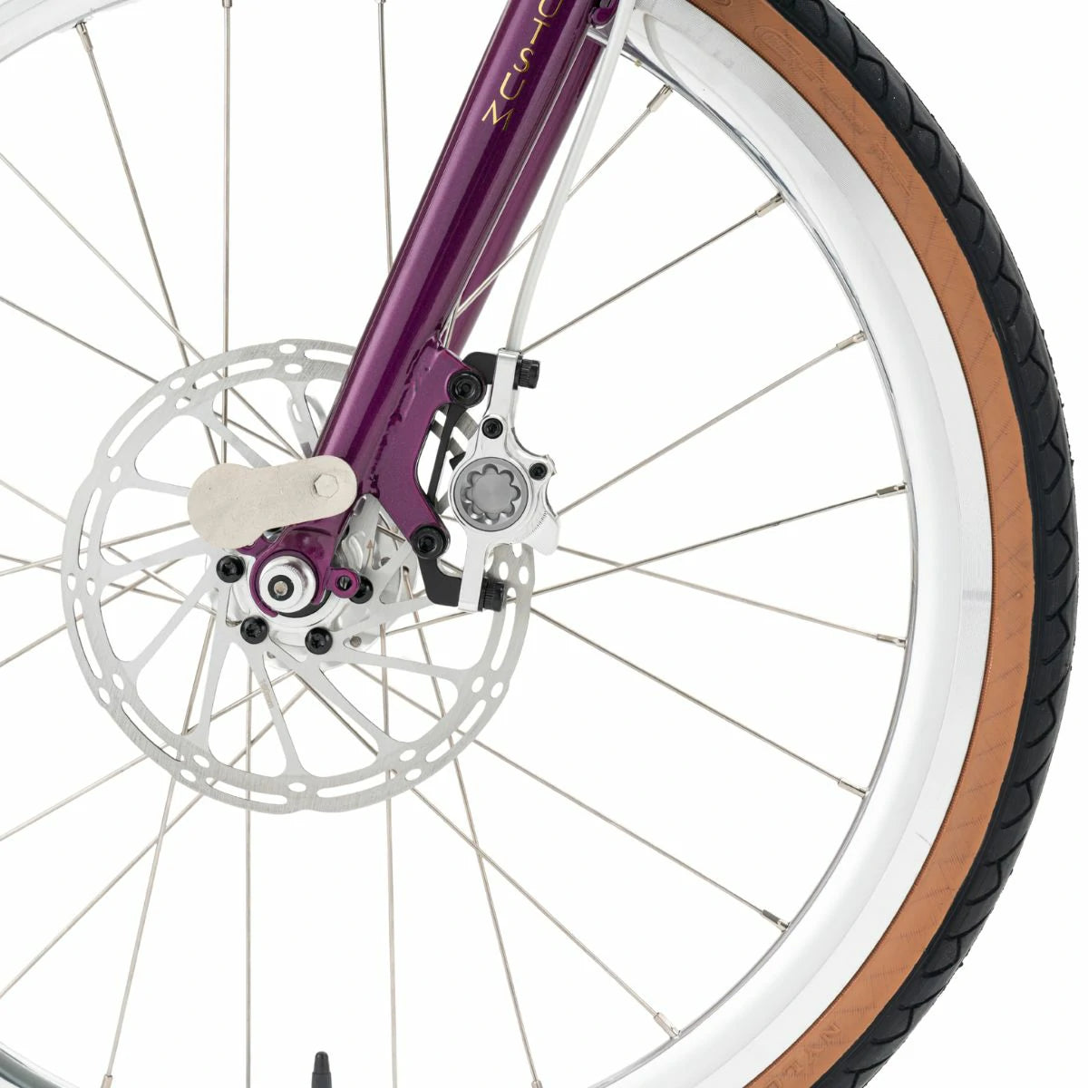 Close-up of a bicycle wheel with purple frame and brown tire on a white background #Color_Purple