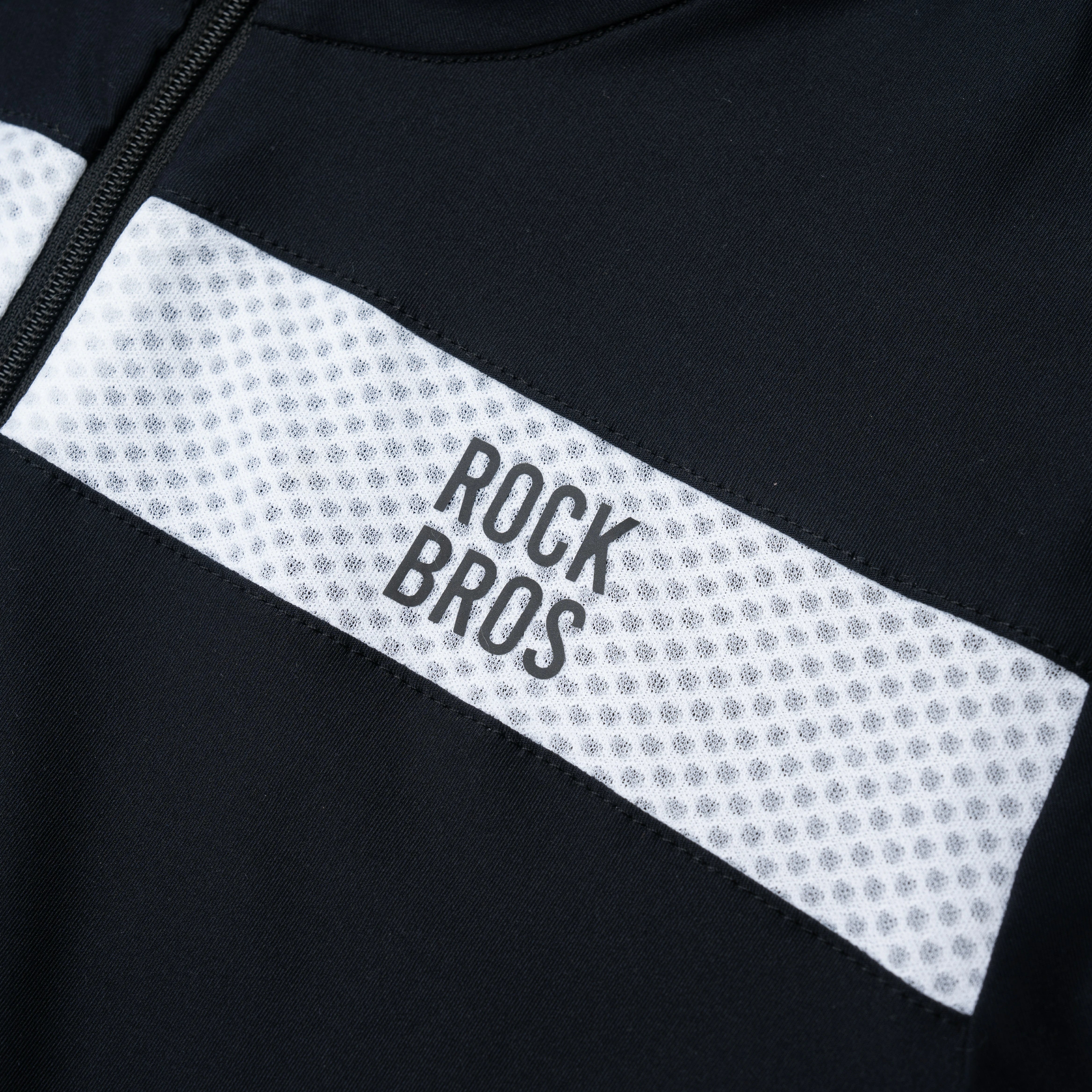 Close-up of a black and white jacket with 'Rock Bros' branding.