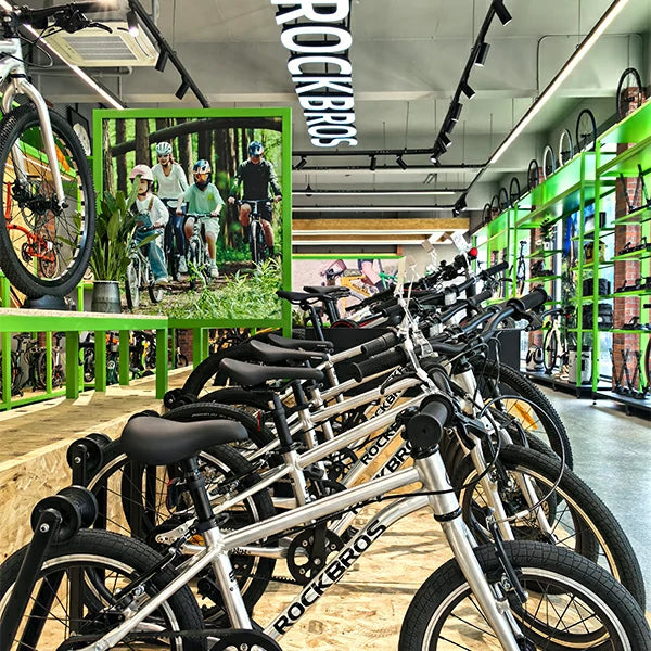ROCKBROS Bicycle store interior with rows of bicycles and promotional display.