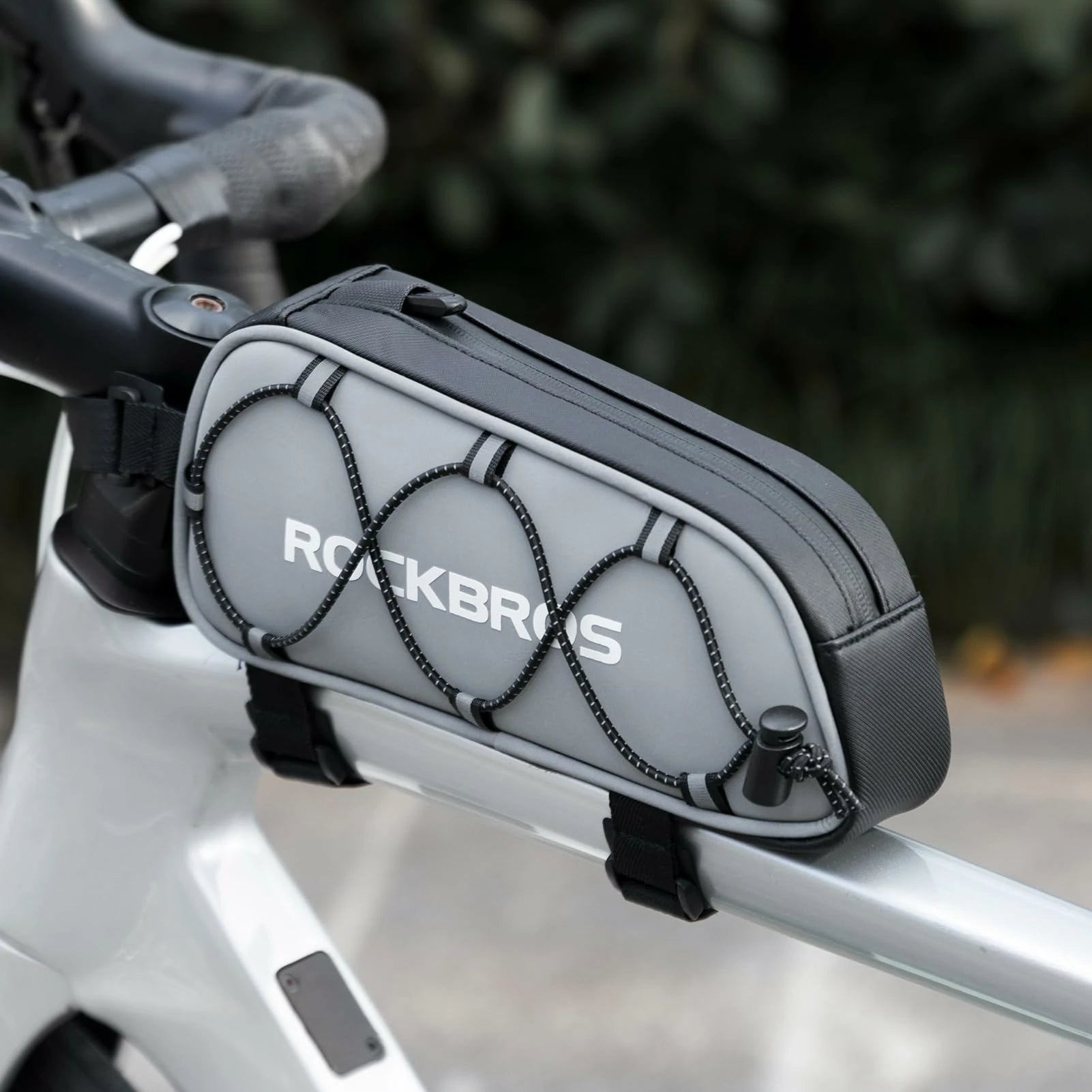 Bicycle frame bag with 'ROCKBROS' branding attached to a bike handlebar.  #color_silver