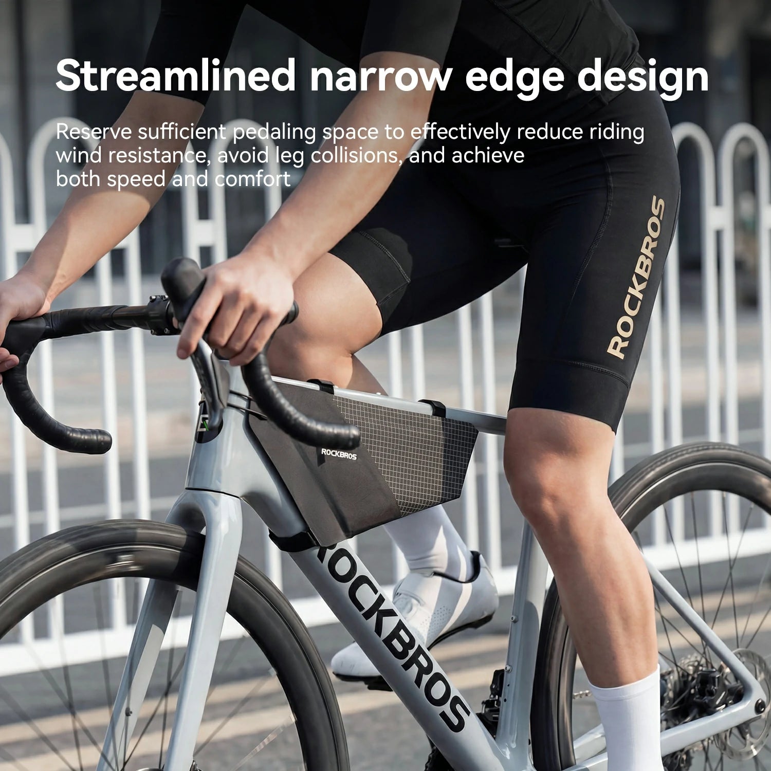 Person riding a bicycle with a ROCKBROS bag, wearing black cycling shorts with the brand name.