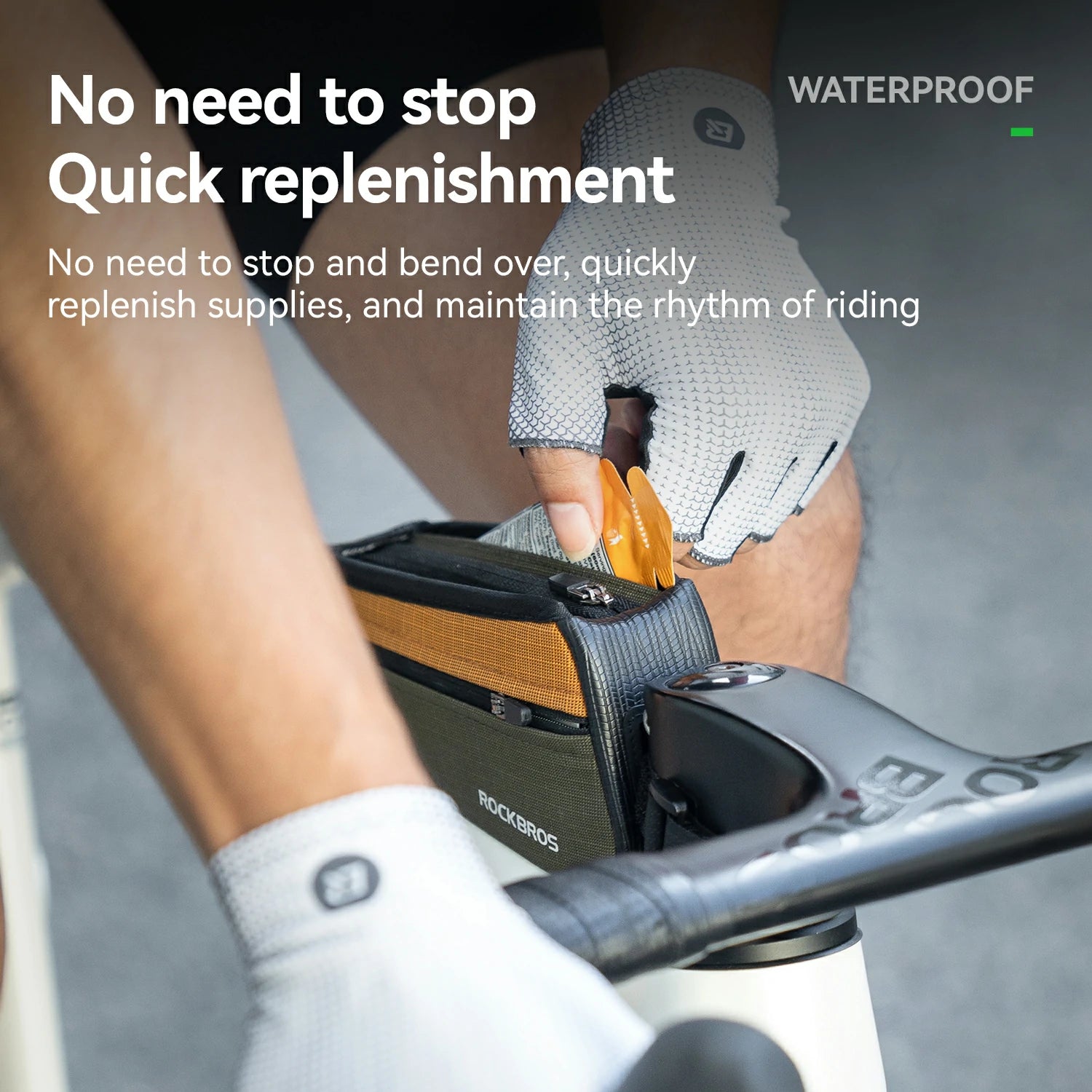 A close-up lifestyle shot of a cyclist wearing white RockBros gloves and a black RockBros saddle bag mounted on a bicycle handlebar. The bag has a wood-grain pattern on the front and a small orange accessory is being inserted into a drainage or refill port.