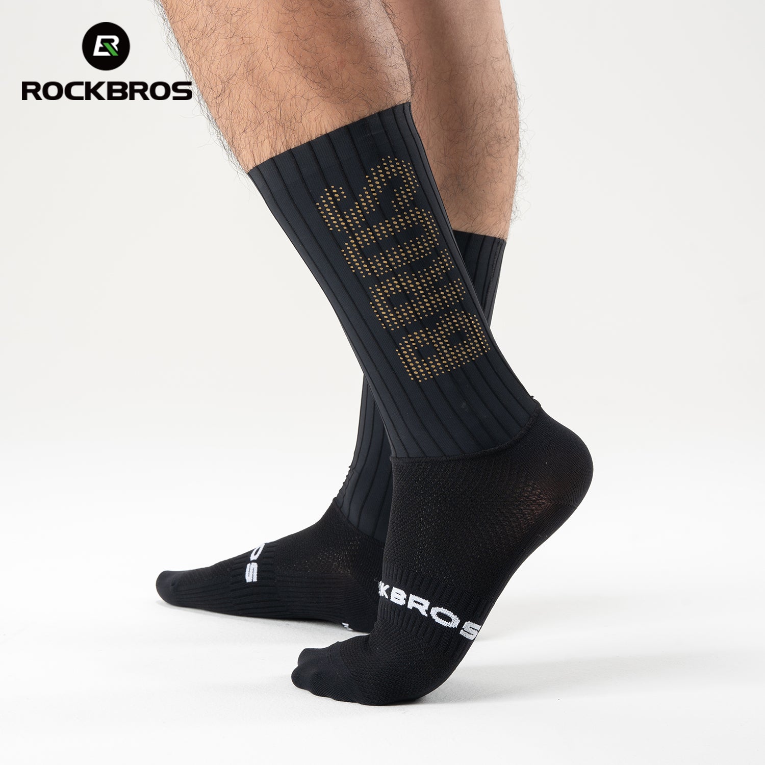 Black socks with gold text worn by a person on a white background, featuring the RockBros brand. #color_Black Stripes - Gold Label