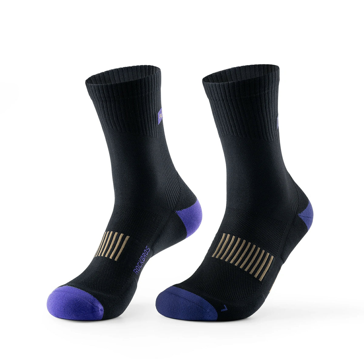 A pair of black crew-length athletic socks with purple toe caps and heel accents, featuring gold striped compression zones on the instep, shown against a plain white background. #Color_Black*2