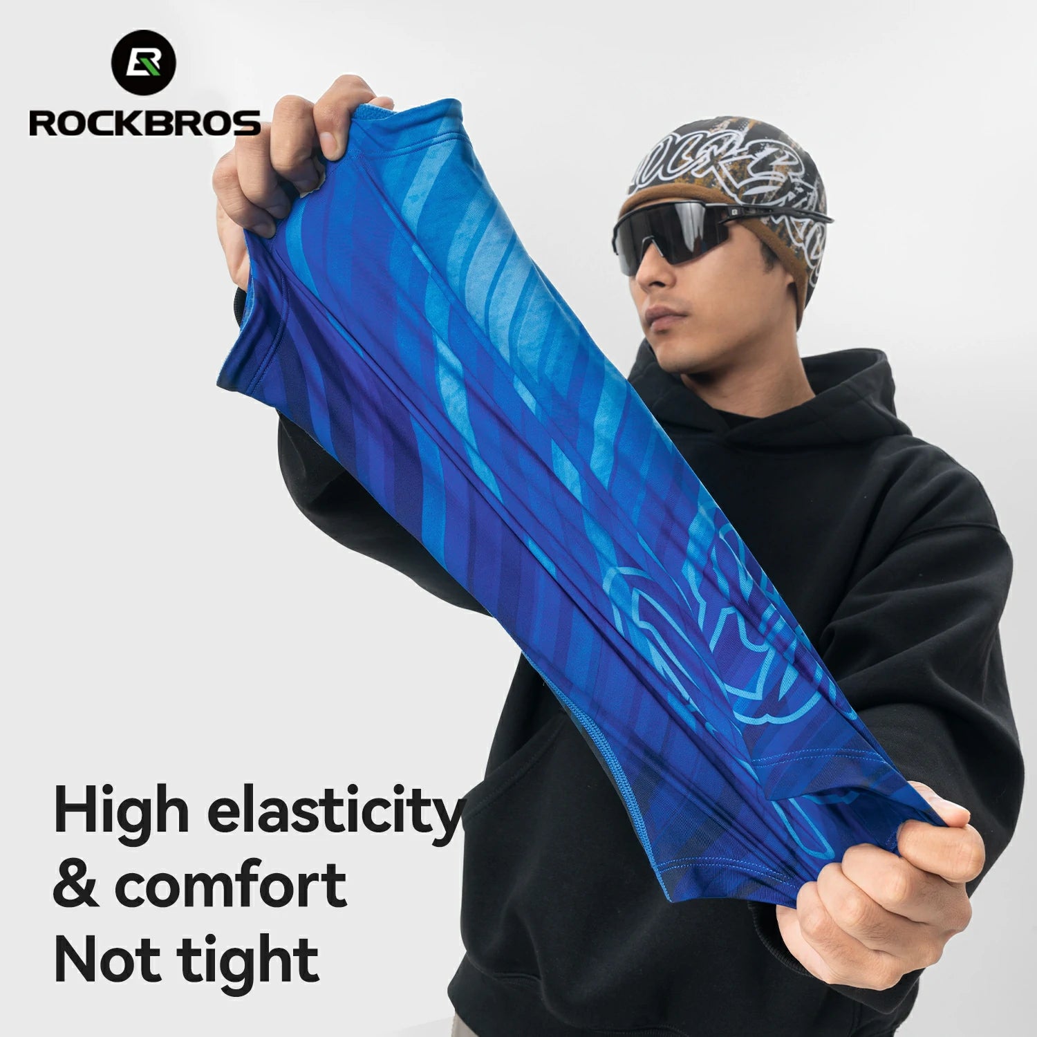 Person holding a blue garment with 'RockBros' branding on a white background