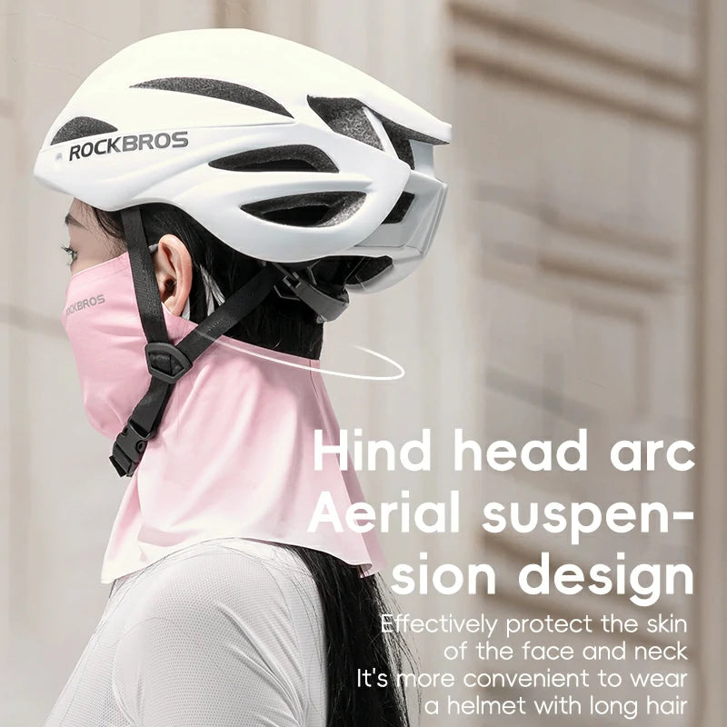 Person wearing a white helmet with 'RockBros' branding, suitable for those with long hair.