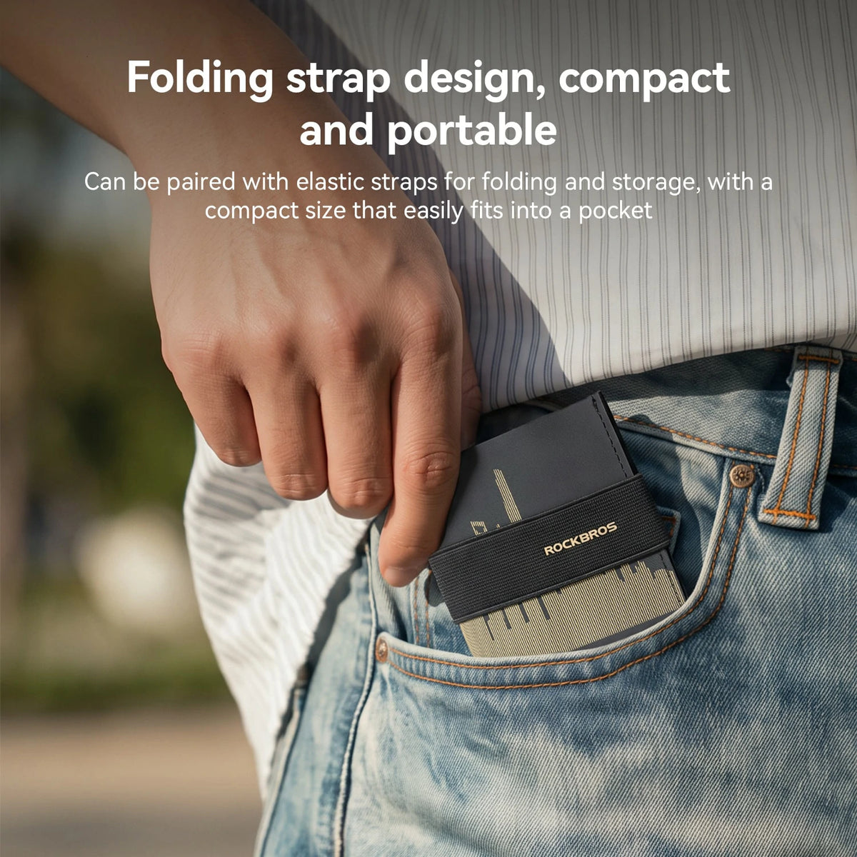 A close-up of a person's hand placing a black ROCKMARS folding card holder into a blue jeans pocket. White text at the top describes the product's features, including its folding strap design, compact size, and portability.