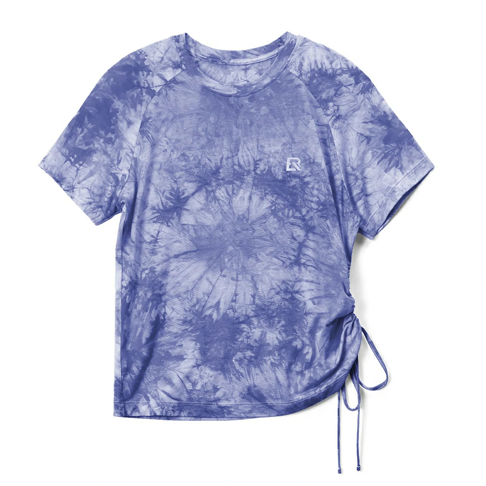 A short-sleeve tie-dye t-shirt in shades of blue and white, featuring a small white embroidered 'R' logo on the left chest and a side drawstring hem, shown flat on a white background. #Color_Purple(Women)