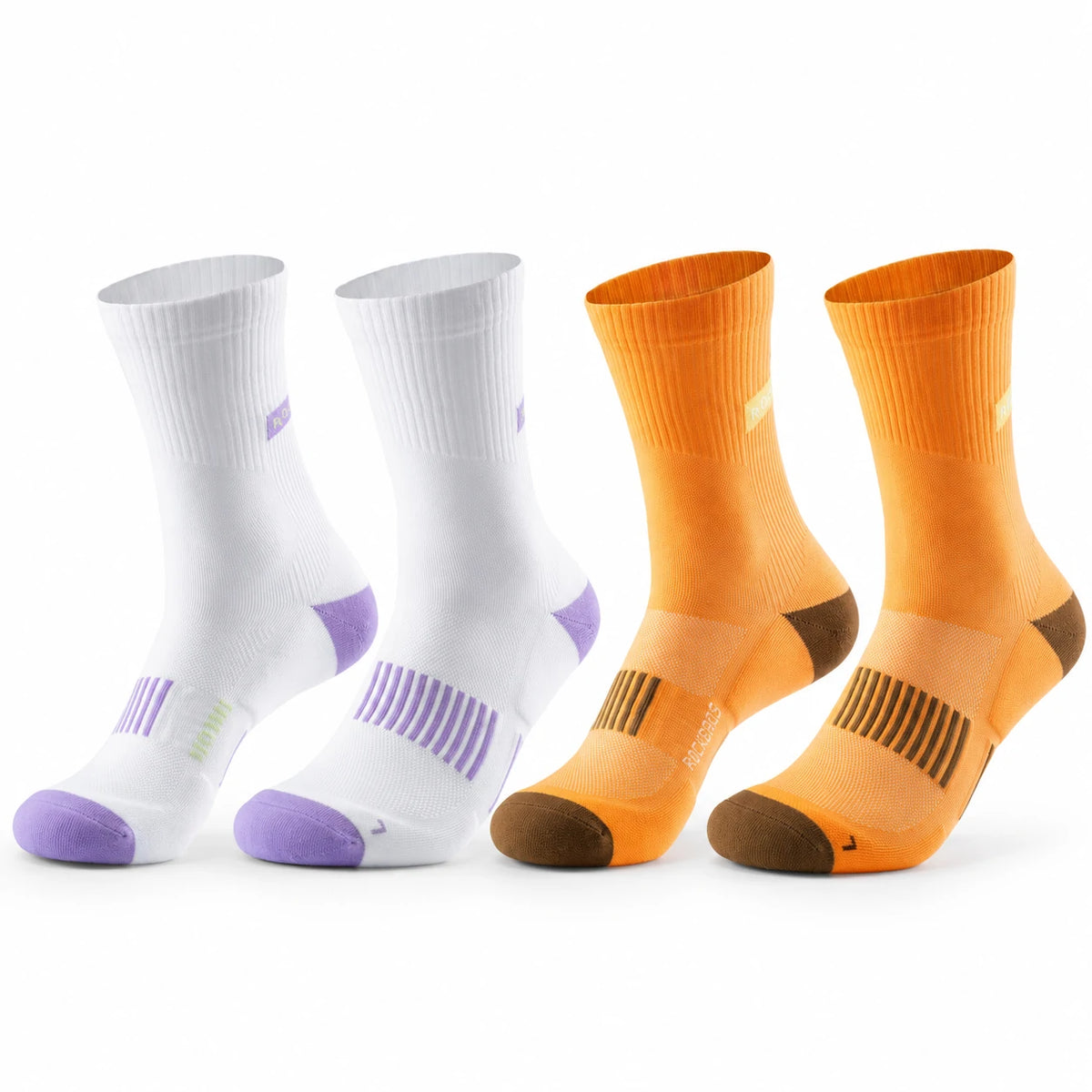 Four athletic crew socks arranged in pairs on a white background: two white socks with purple accents and two orange socks #Color_orange+white