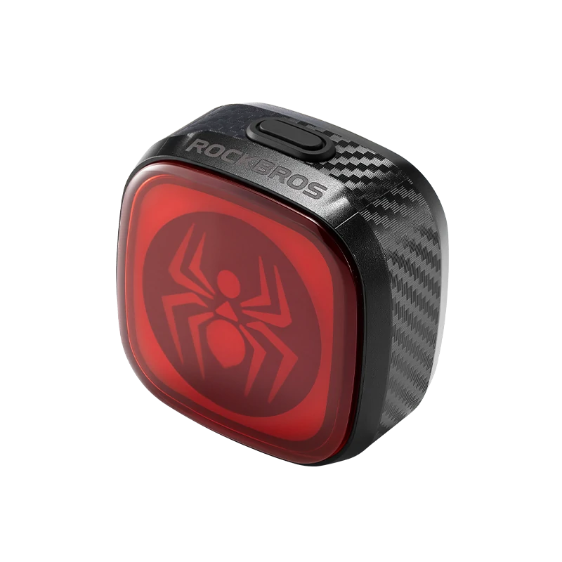 spider icon graphic on a red bicycle tail light #Color_Spider Symbol