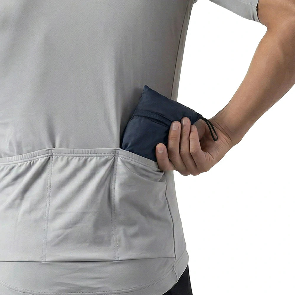 Packable cycling jacket with zoned core heat dissipation.