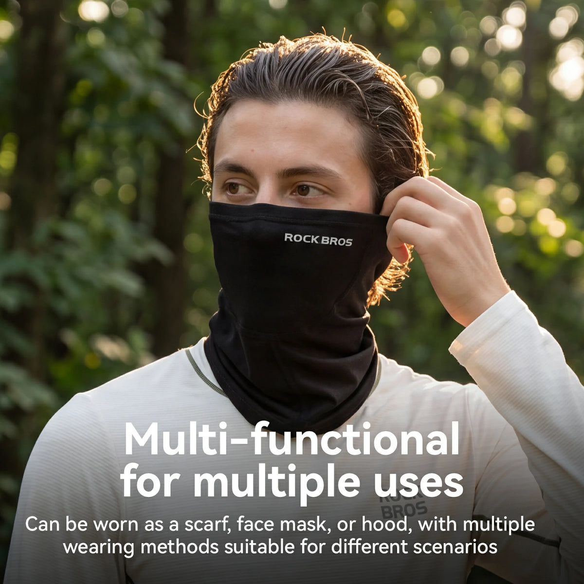 A man wearing a black Rock Bros neck gaiter or face mask outdoors in a wooded setting, adjusting the mask with one hand. White text at the bottom reads 'Multi-functional for multiple uses' with additional descriptive text about wearing it as a scarf, face mask, or hood.