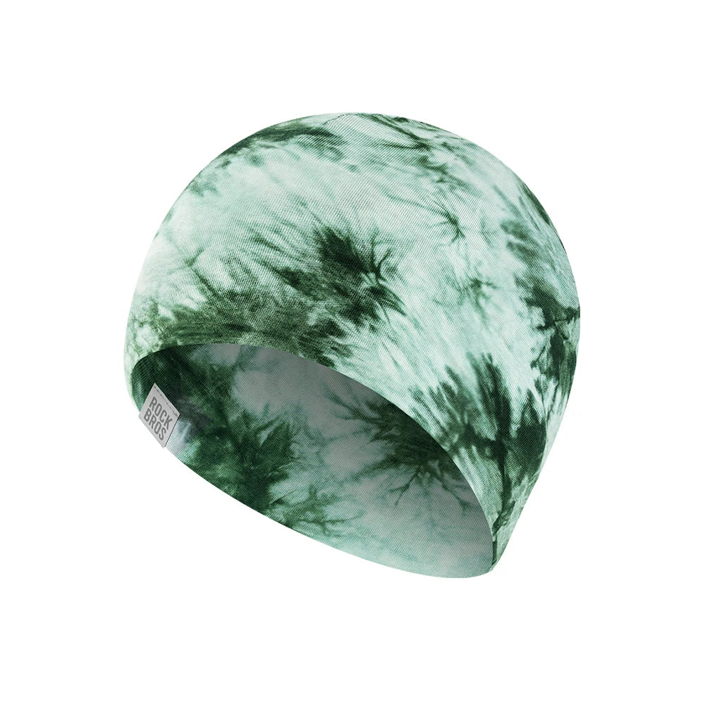 A fabric beanie hat featuring a green and white tie-dye pattern, shown on a plain white background. #Color_Green