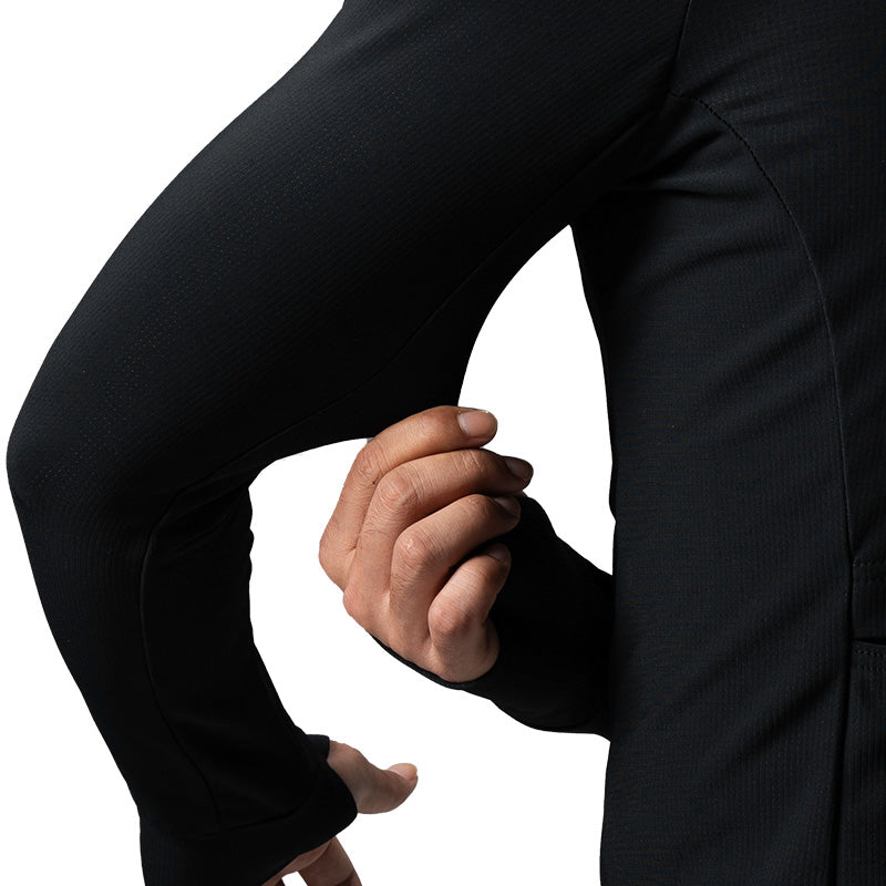 Person wearing a black long-sleeve shirt on a white background