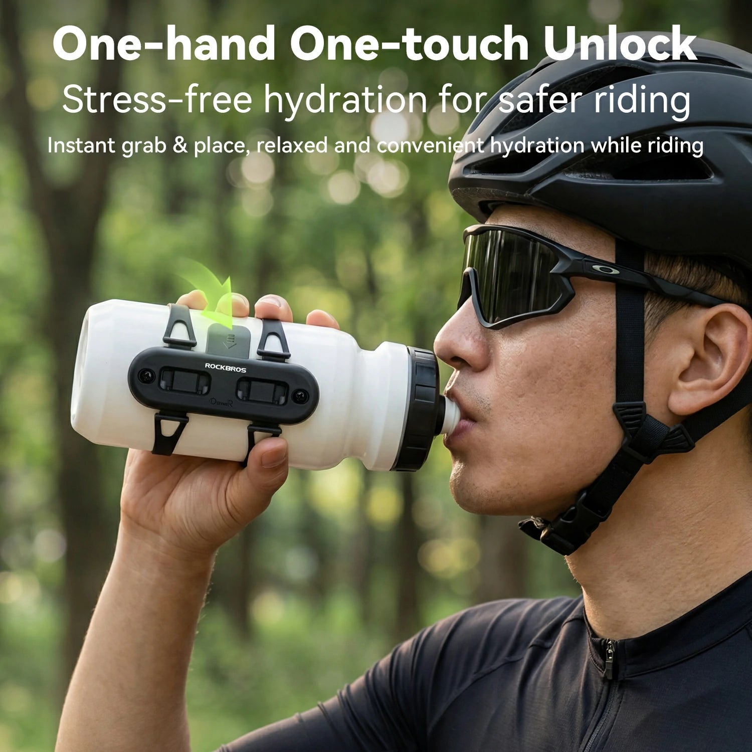 A man wearing a black cycling helmet and sunglasses drinks from a white and black RockBros water bottle with a green straw, set against a blurred forest background with promotional text at the top.