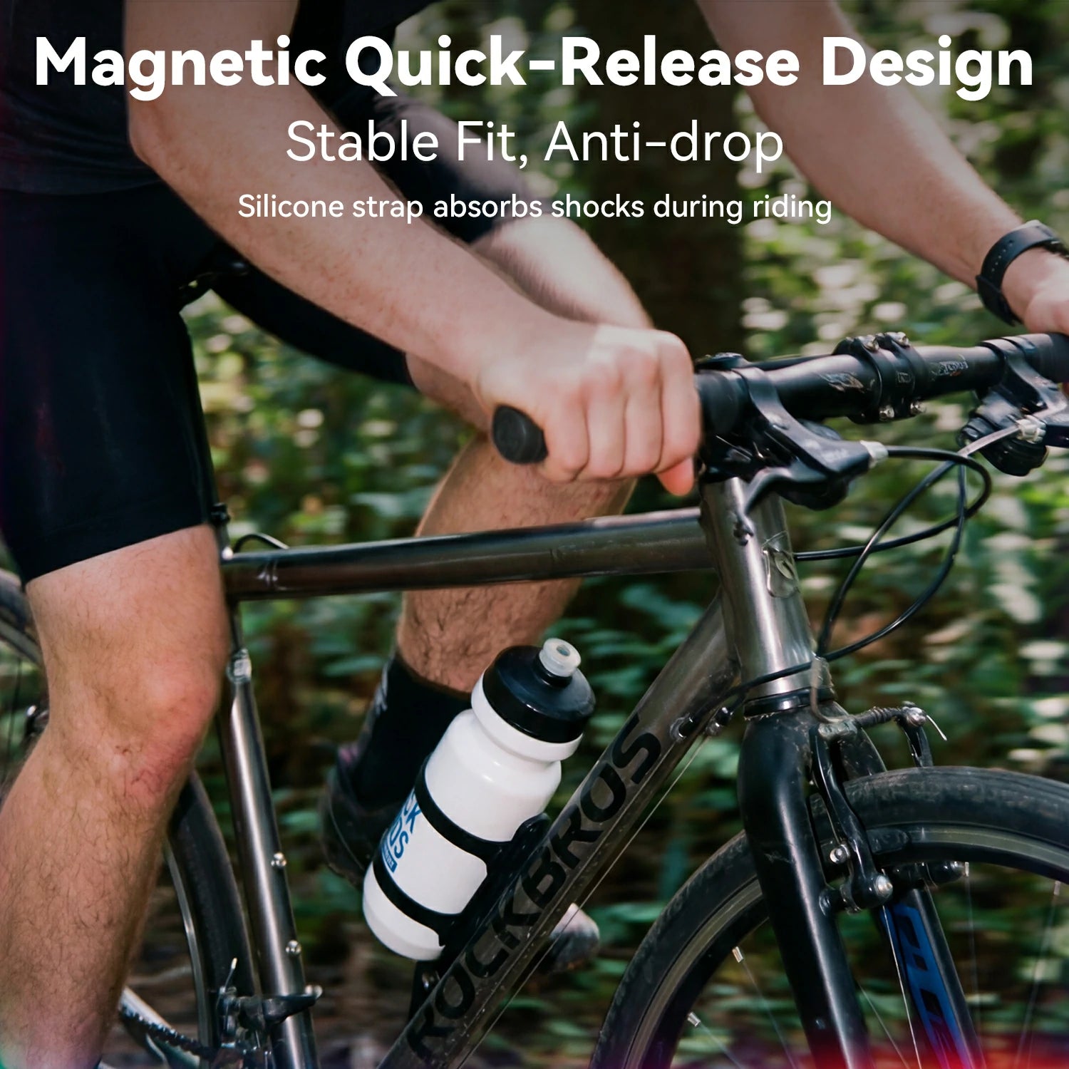 A close-up of a cyclist riding a black RockBros bicycle outdoors, wearing a black quick-release bottle holder around a white water bottle. White text at the top reads 'Magnetic Quick-Release Design' and 'Stable Fit, Anti-drop' with additional feature copy below.