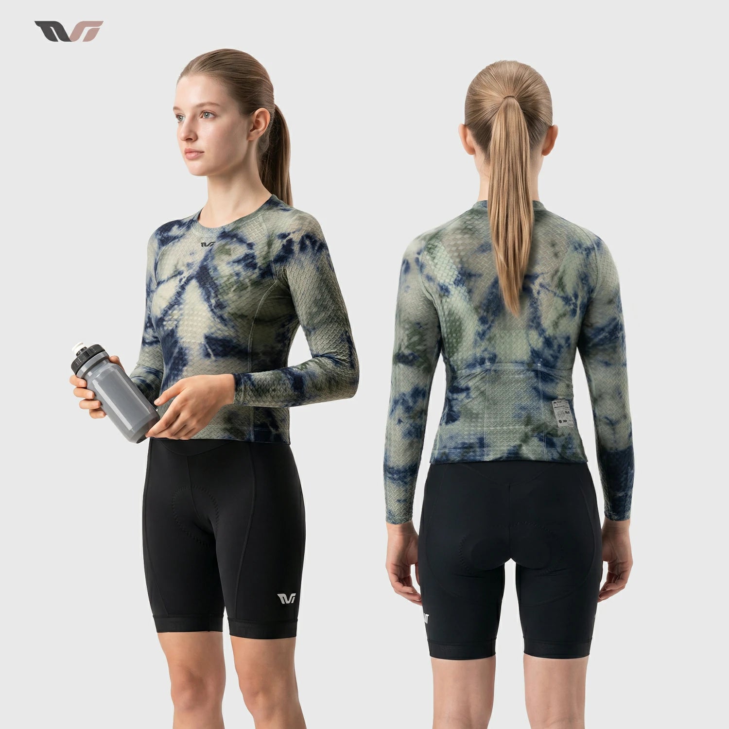 A female cyclist shown from the front and back wearing a long-sleeve athletic jersey with a blue and green tie-dye pattern and black biker shorts, against a light gray studio background.