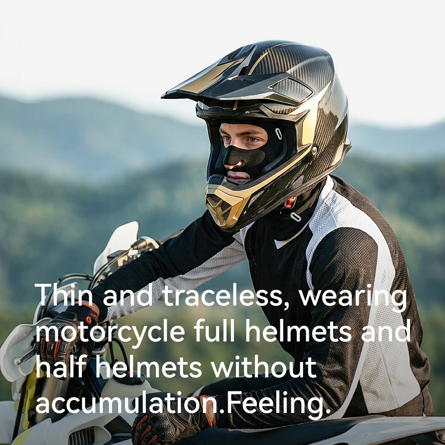 Person wearing a motorcycle helmet with scenic background